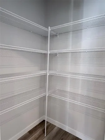 a view of a room with racks on the wall