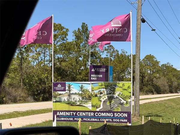 a view of a house with a yard and garage