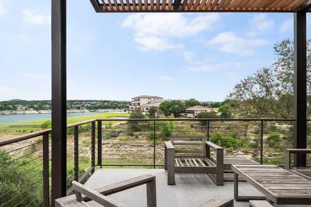a view of a balcony with lake view and mountain view