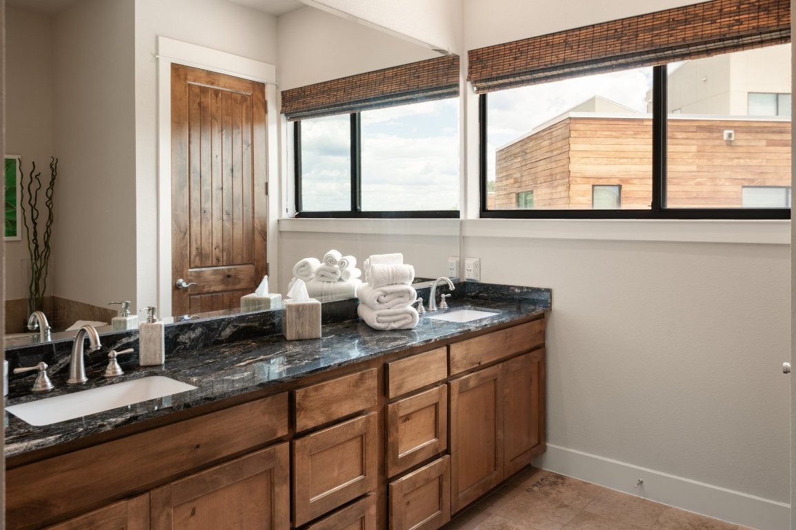 1101 Ivean Pearson Road, Unit E201 Leander, TX 78645 - Photo 14 of 20 a kitchen with sink and large window