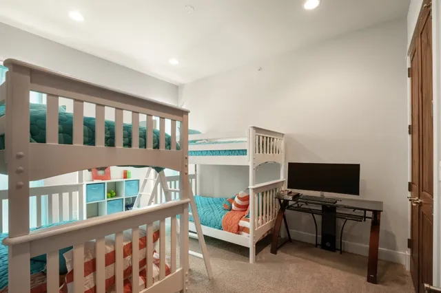 a bedroom with furniture and a window