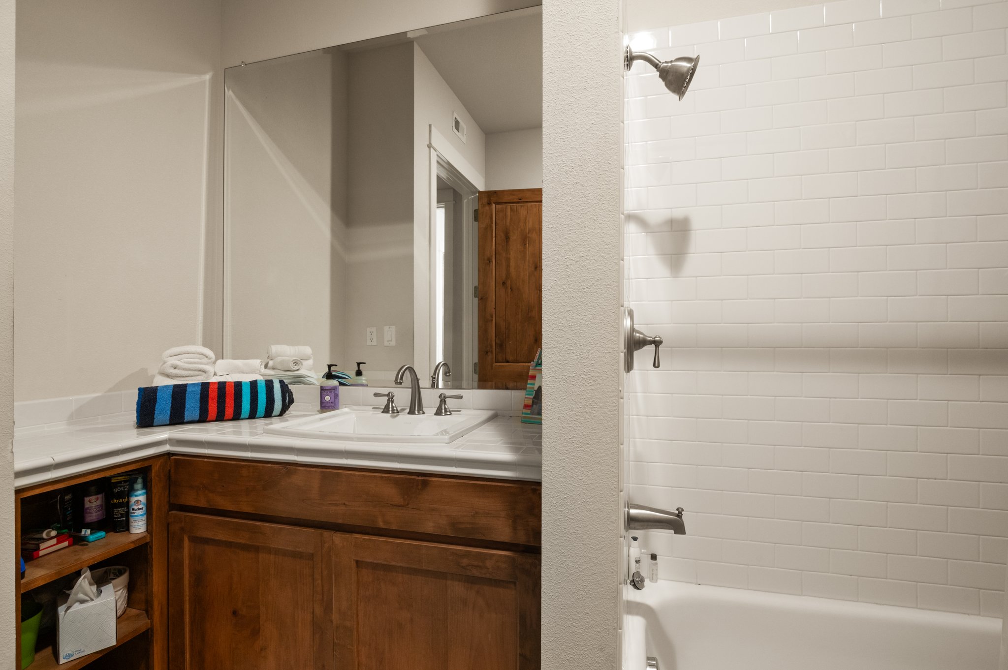 1101 Ivean Pearson Road, Unit E201 Leander, TX 78645 - Photo 16 of 20 Full bath featuring vanity and washtub / shower combination