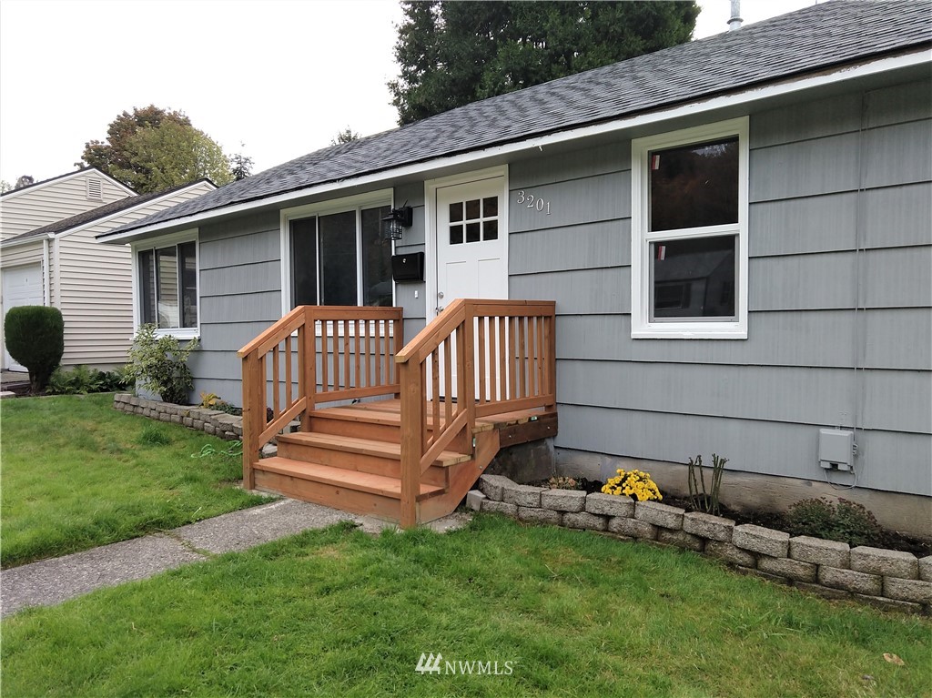 3201 Southeast 5th Street Renton, WA 98058 - Photo 1 of 17 a front view of a house with a garden
