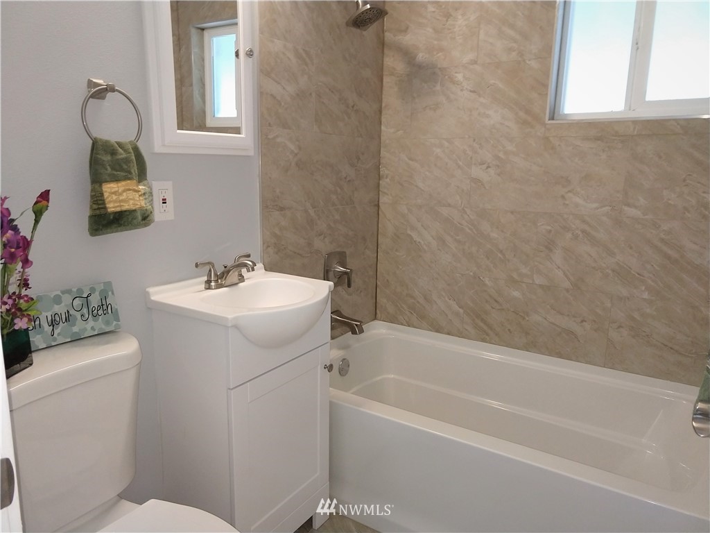 3201 Southeast 5th Street Renton, WA 98058 - Photo 14 of 17 a bathroom with a sink a toilet and shower