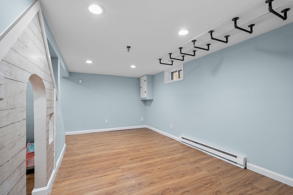 13 Mohegan Road Acton, MA 01720 - Photo 30 of 39 a view of a hallway with wooden floor