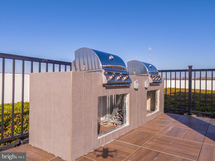 4550 Mitchell Street, Unit 208 Philadelphia, PA 19128 - Photo 16 of 25 a view of a balcony with an outdoor space