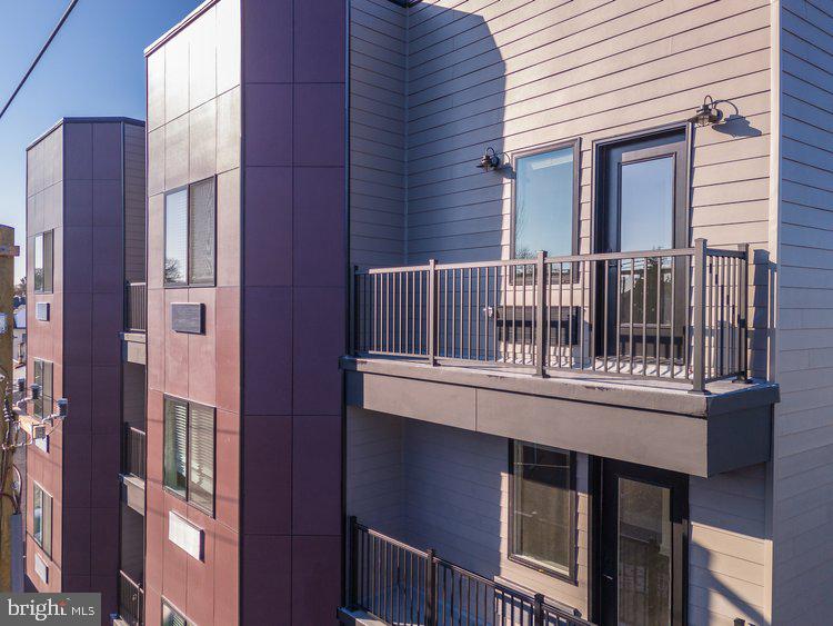 4550 Mitchell Street, Unit 208 Philadelphia, PA 19128 - Photo 22 of 25 a view of balcony with furniture