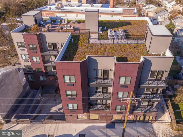 a front view of a building with glass windows