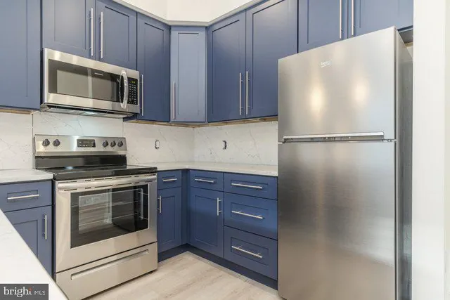 a white refrigerator freezer and a stove top oven