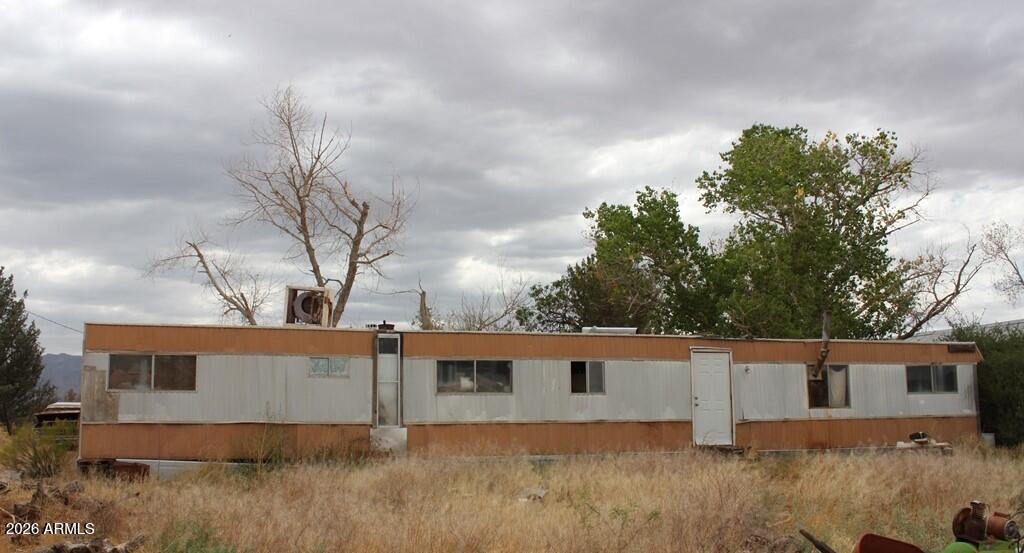 a backyard of a house with wooden fence
