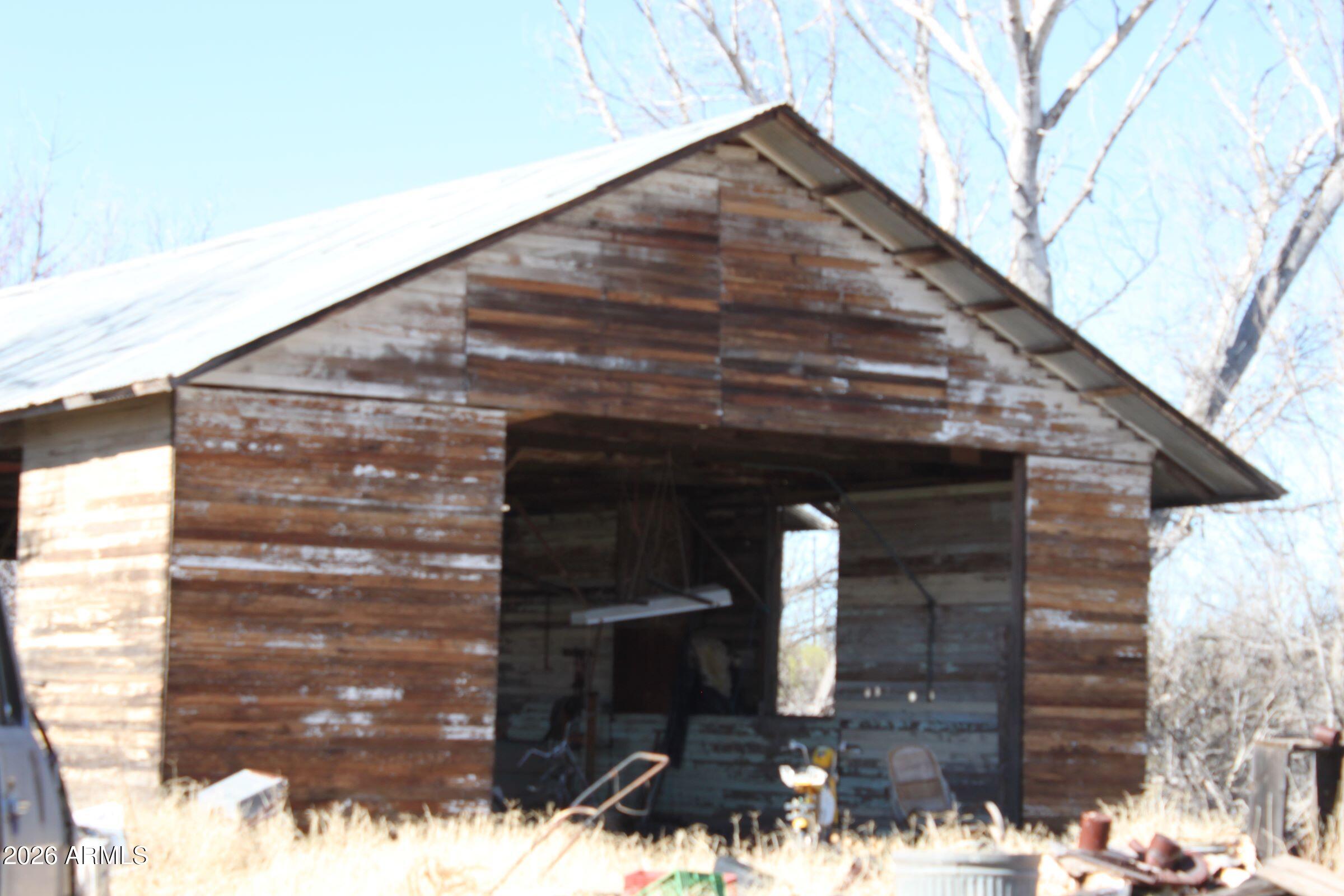 9073 South O'Neil Road Hereford, AZ 85615 - Photo 4 of 7 a front view of a house with parking
