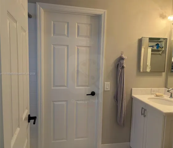 a bathroom with a sink and mirror