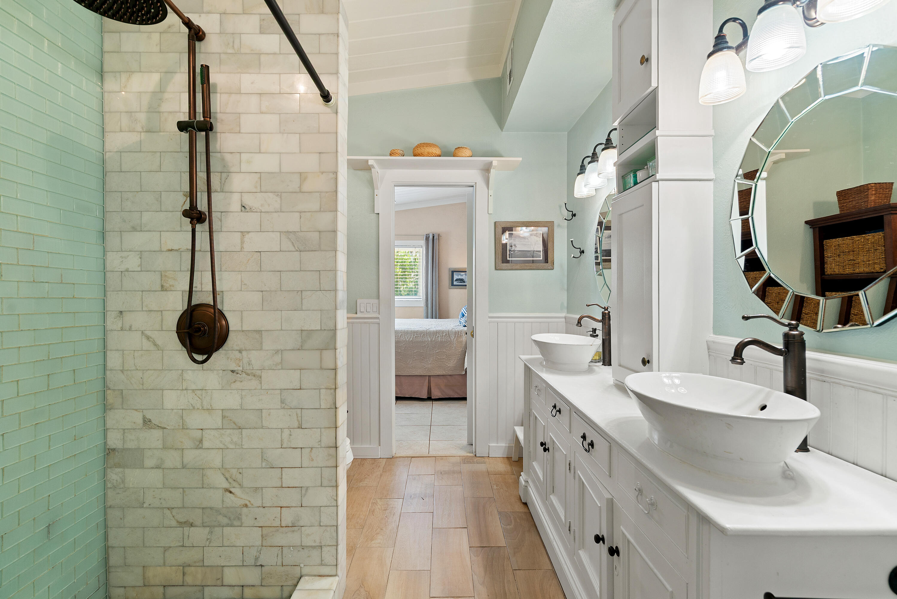 412 3rd Street Key Largo, FL 33037 - Photo 20 of 41 a bathroom with a double vanity sink a toilet a mirror and shower