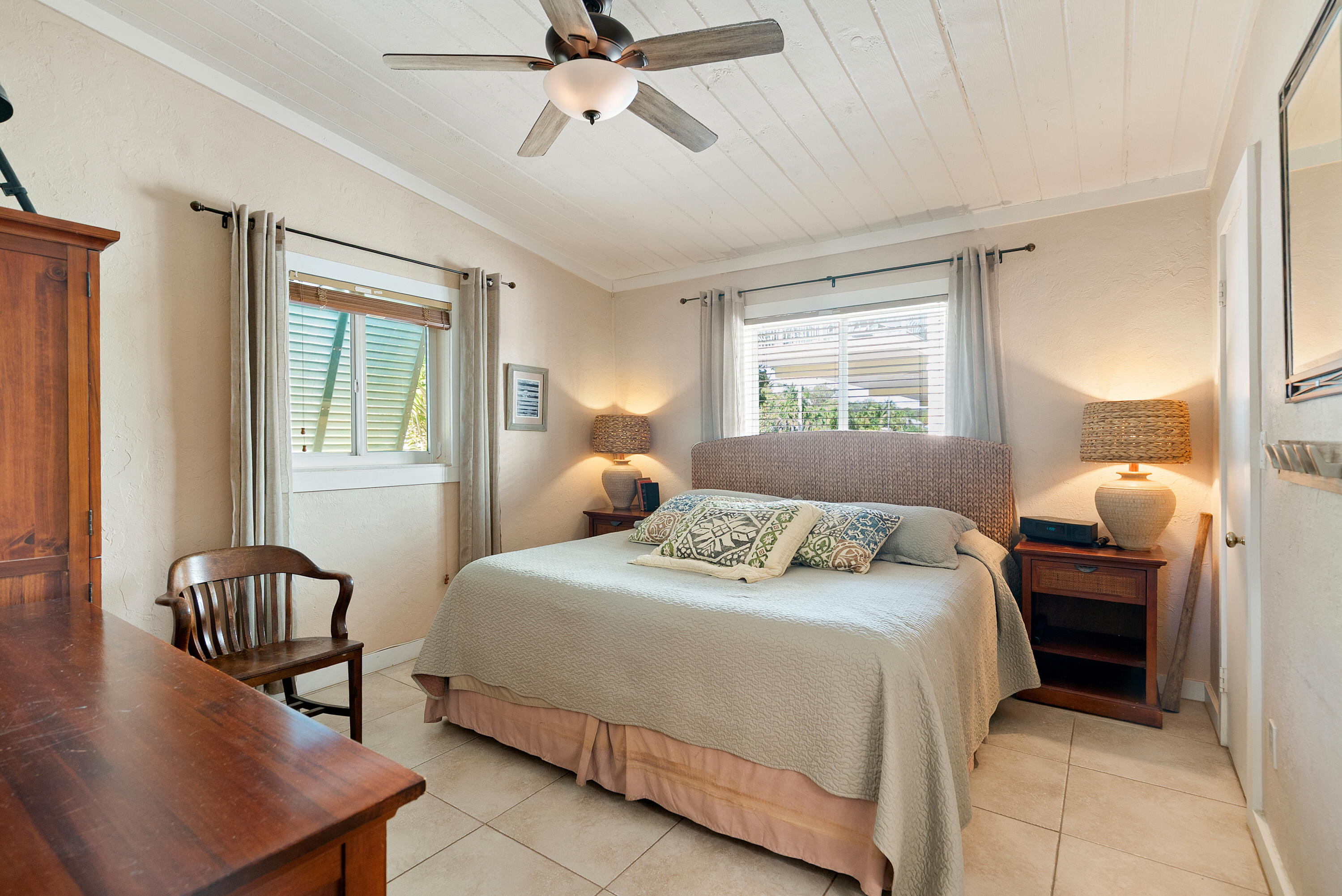 412 3rd Street Key Largo, FL 33037 - Photo 22 of 41 a bedroom with a bed and a chandelier