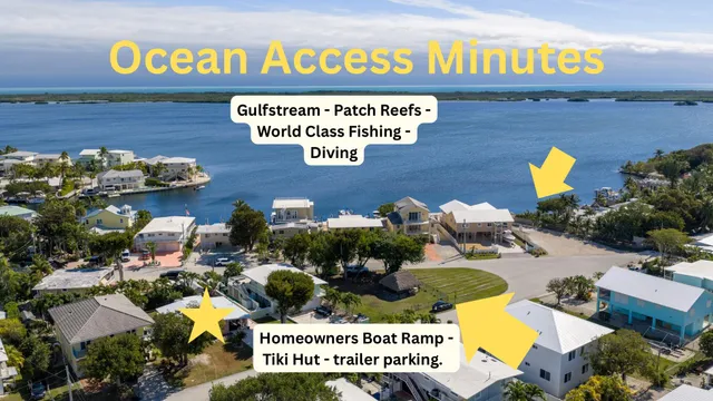 a view of a street with an ocean