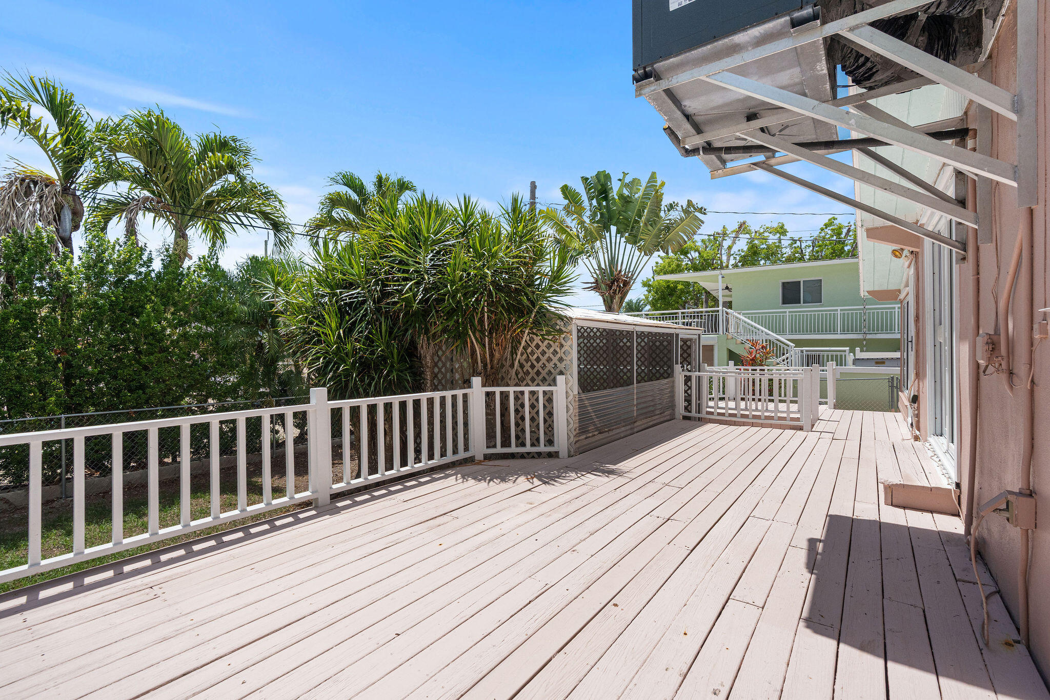 412 3rd Street Key Largo, FL 33037 - Photo 30 of 41 a view of a wooden deck with a patio