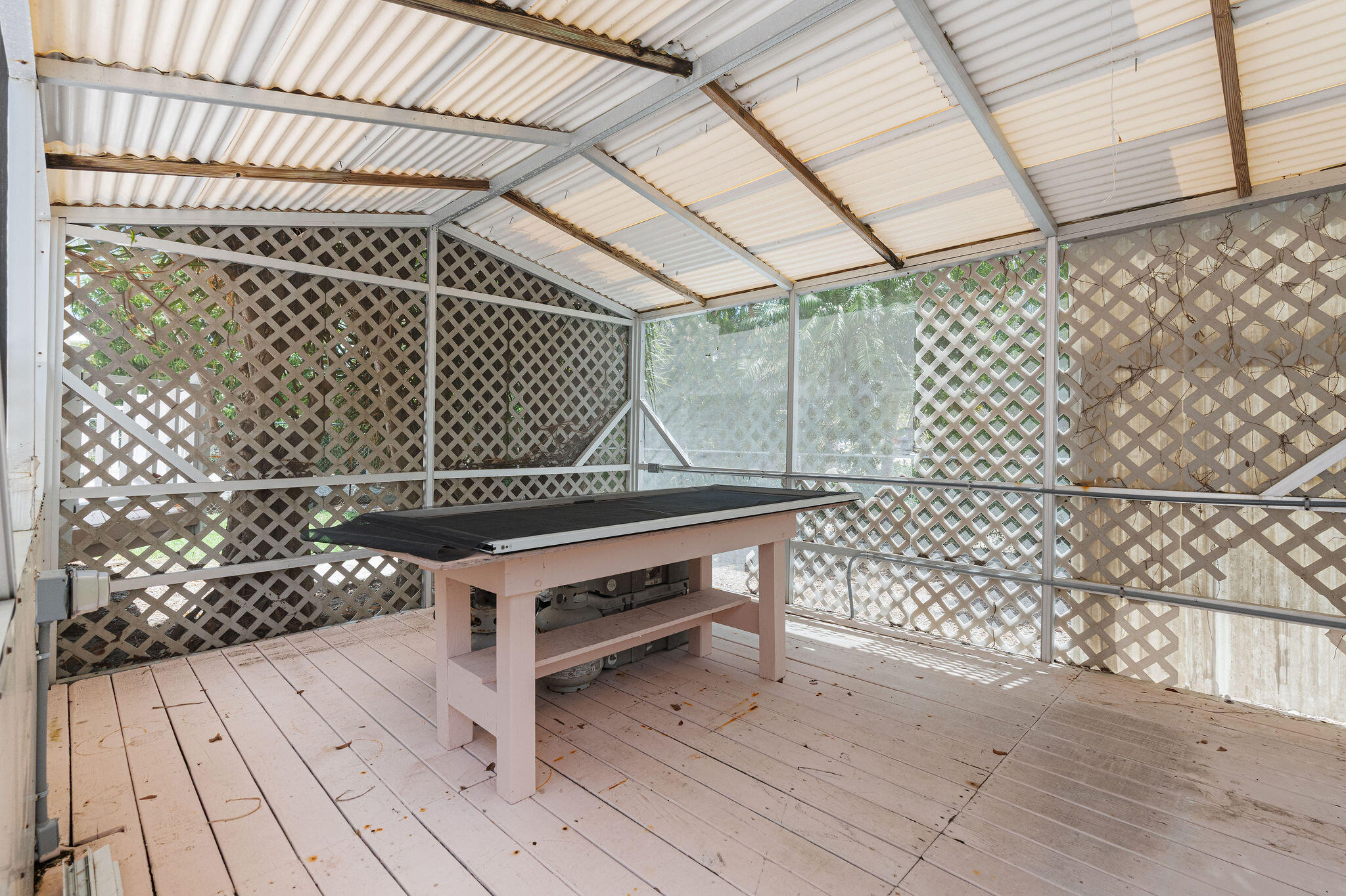 412 3rd Street Key Largo, FL 33037 - Photo 33 of 41 a view of a bench in wooden floor
