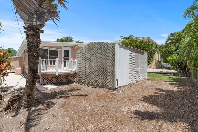 a view of a house with a yard and a garden