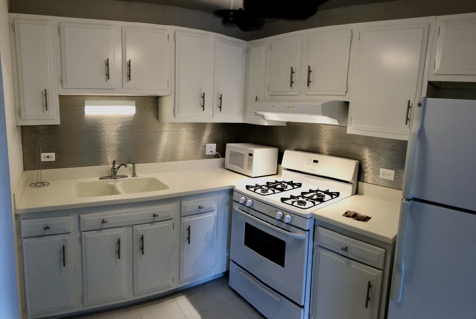 3523 Central Road, Unit 302 Glenview, IL 60025 - Photo 3 of 8 a kitchen with cabinets appliances and a sink