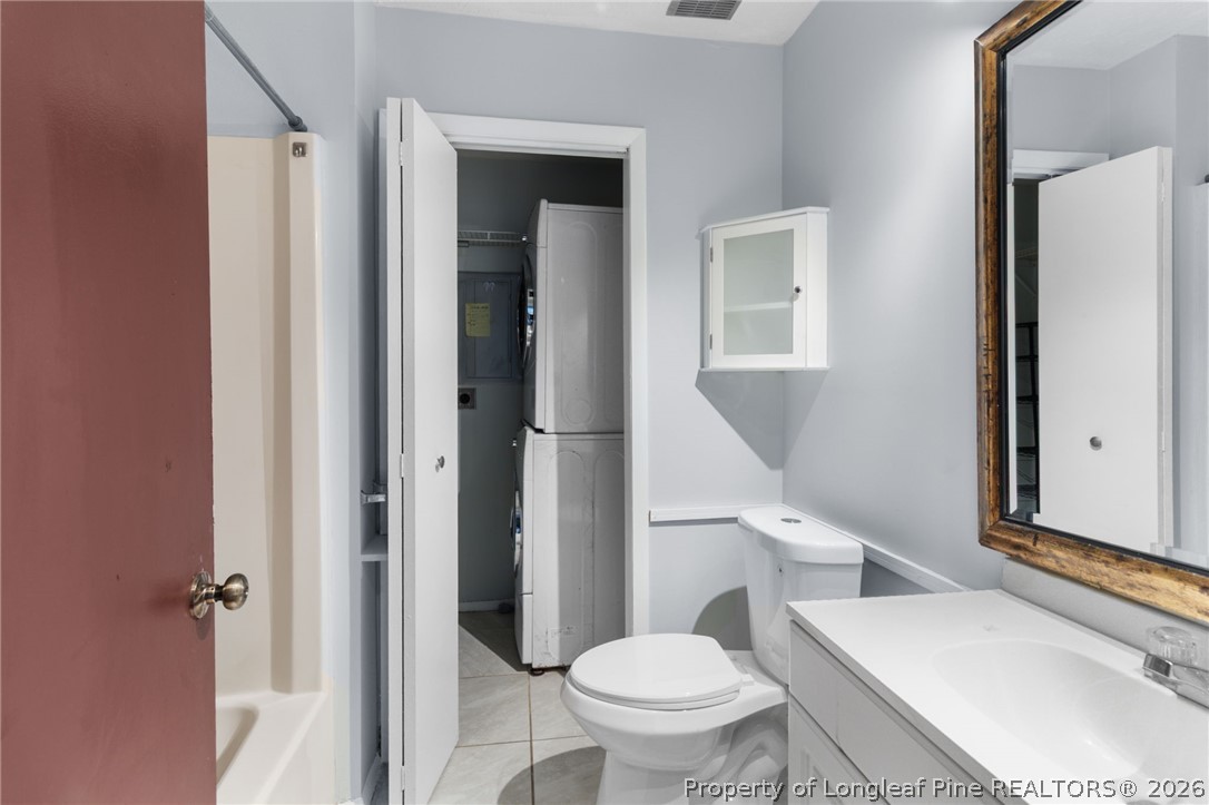 1908 Tryon Drive, Unit 1 Fayetteville, NC 28303 - Photo 23 of 29 a white toilet sitting next to a bathroom sink