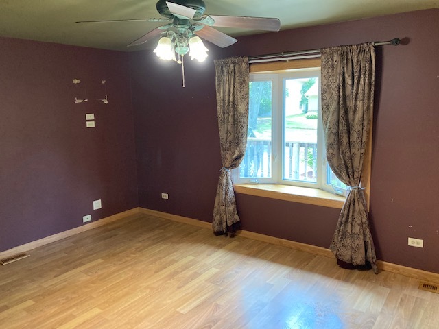 22201 Rockingham Road Richton Park, IL 60471 - Photo 5 of 18 wooden floor and window in an empty room