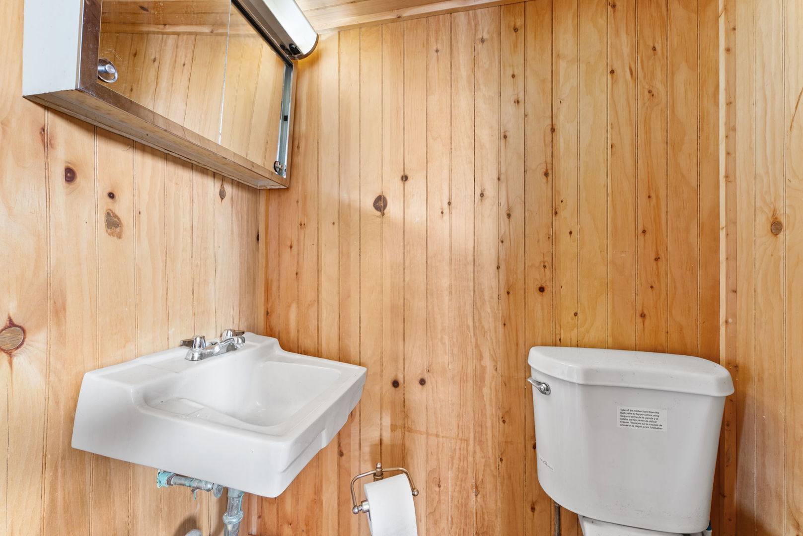 1135 5th Avenue North Clinton, IA 52732 - Photo 18 of 22 a bathroom with a sink a toilet and a mirror