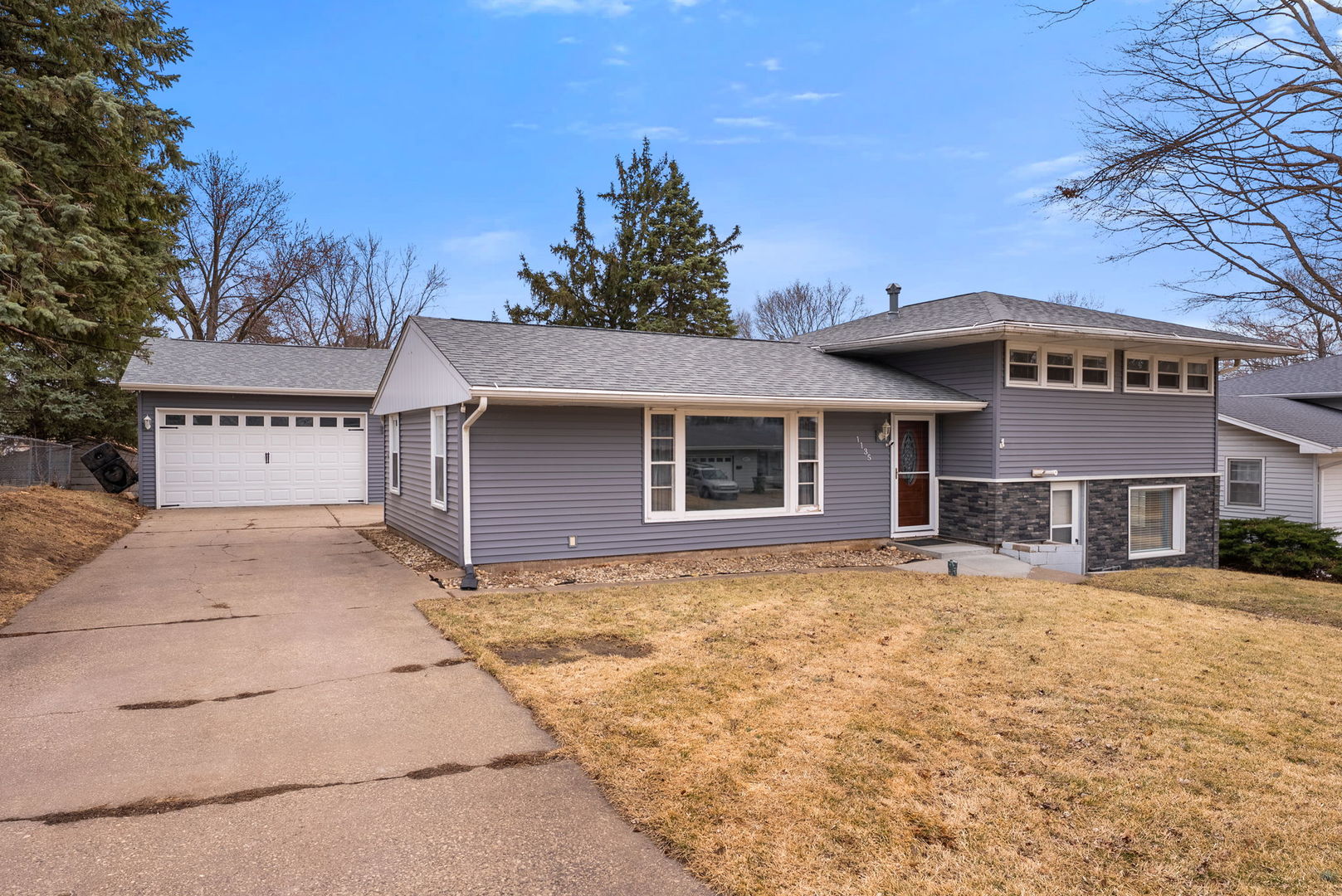 1135 5th Avenue North Clinton, IA 52732 - Photo 2 of 22 a front view of a house with a yard