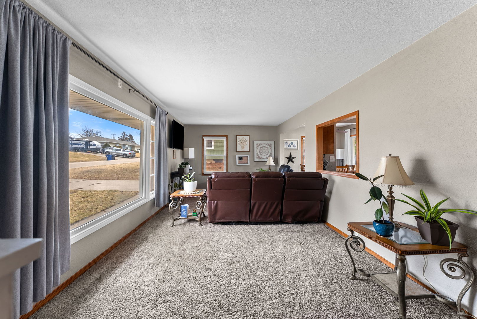 1135 5th Avenue North Clinton, IA 52732 - Photo 4 of 22 a living room with furniture large window and flat screen tv