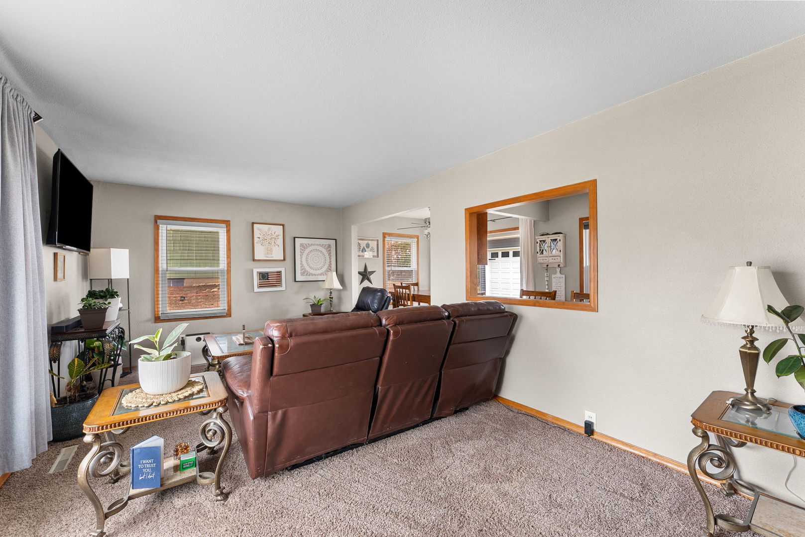 1135 5th Avenue North Clinton, IA 52732 - Photo 5 of 22 a living room with furniture window and a flat screen tv