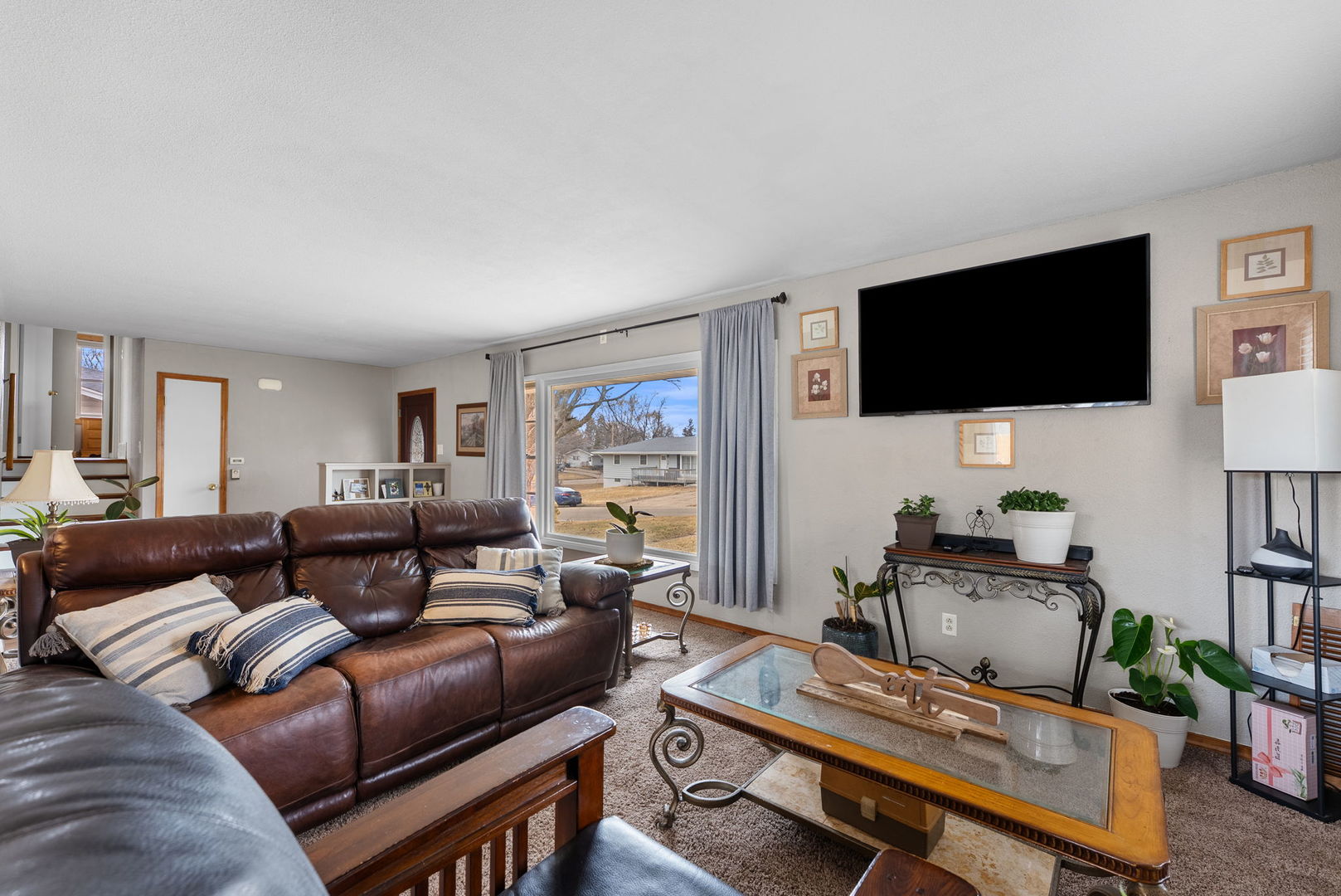 1135 5th Avenue North Clinton, IA 52732 - Photo 7 of 22 a living room with furniture and a flat screen tv