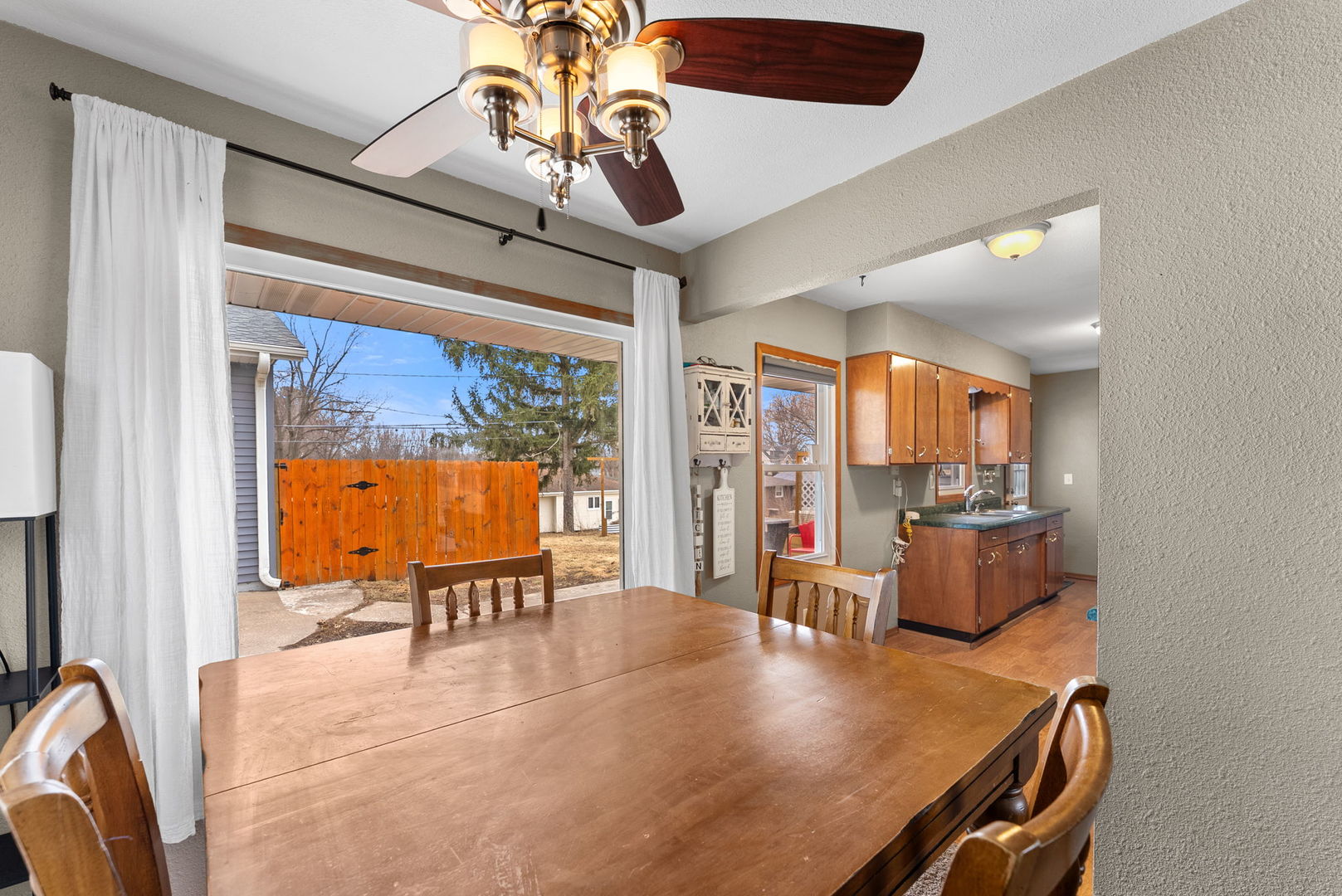 1135 5th Avenue North Clinton, IA 52732 - Photo 8 of 22 a view of a dining room with furniture wooden floor and chandelier