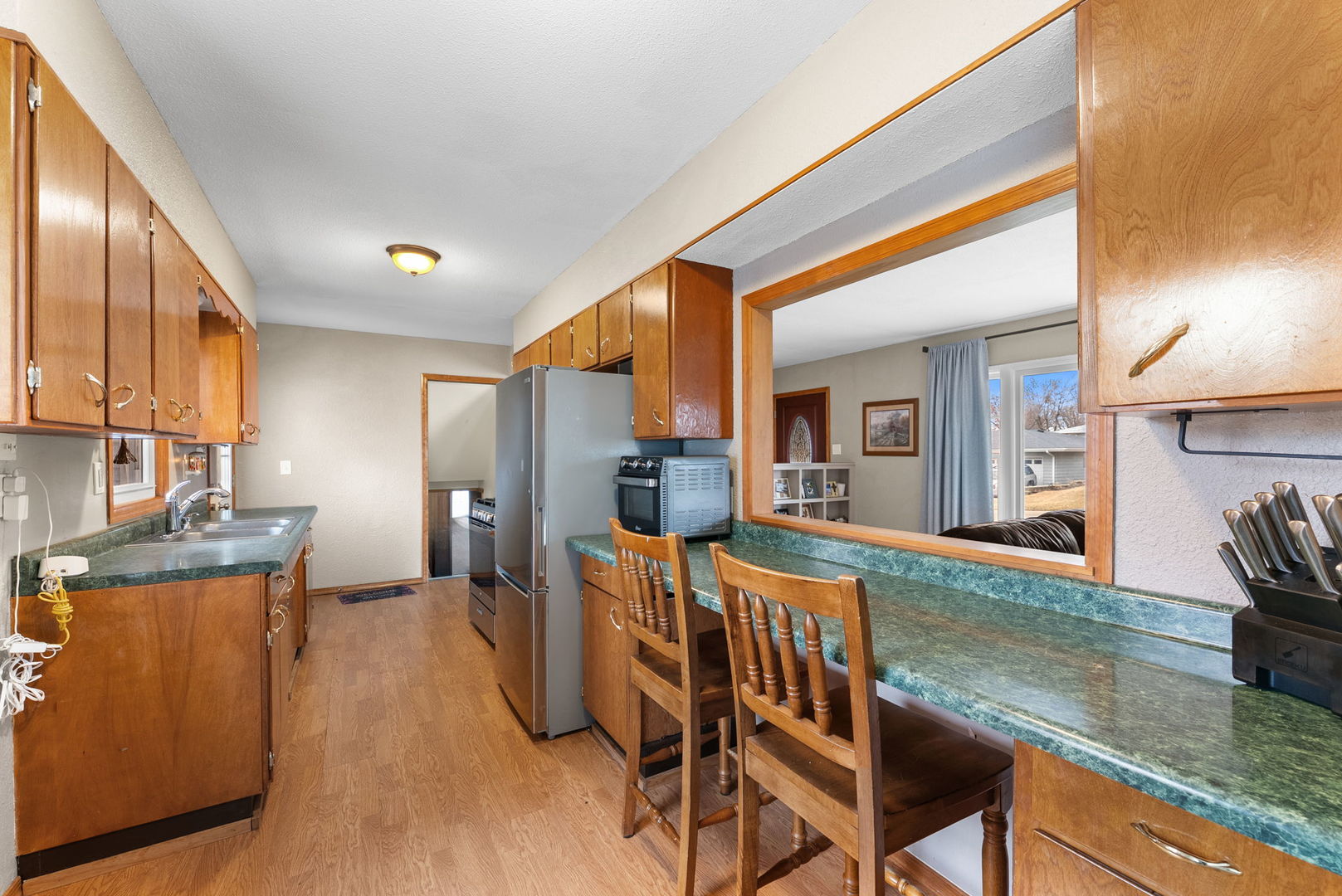 1135 5th Avenue North Clinton, IA 52732 - Photo 9 of 22 a view of a dining room with furniture and a kitchen