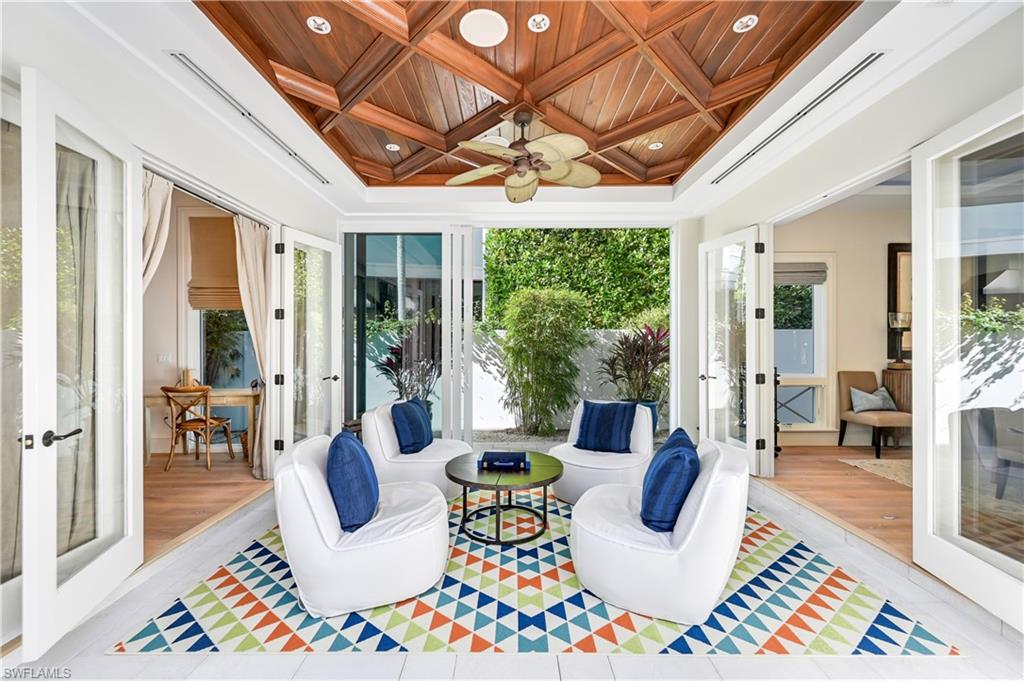 42 6th Street South Naples, FL 34102 - Photo 13 of 46 Sunroom with french doors, wooden ceiling, coffered ceiling, and recessed lighting