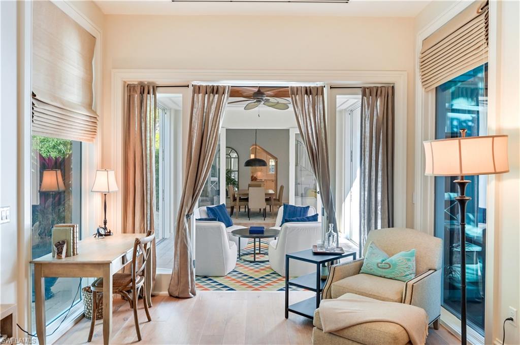 42 6th Street South Naples, FL 34102 - Photo 19 of 46 Sitting room with light wood-type flooring and a ceiling fan