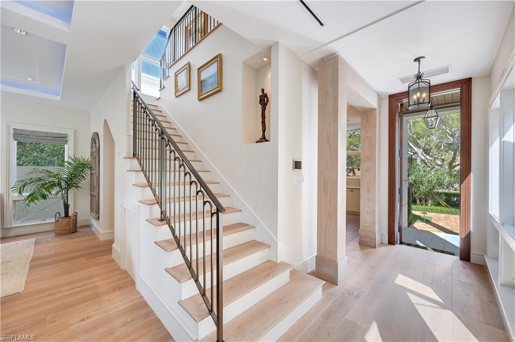 42 6th Street South Naples, FL 34102 - Photo 28 of 46 Foyer entrance featuring light wood-type flooring and recessed lighting