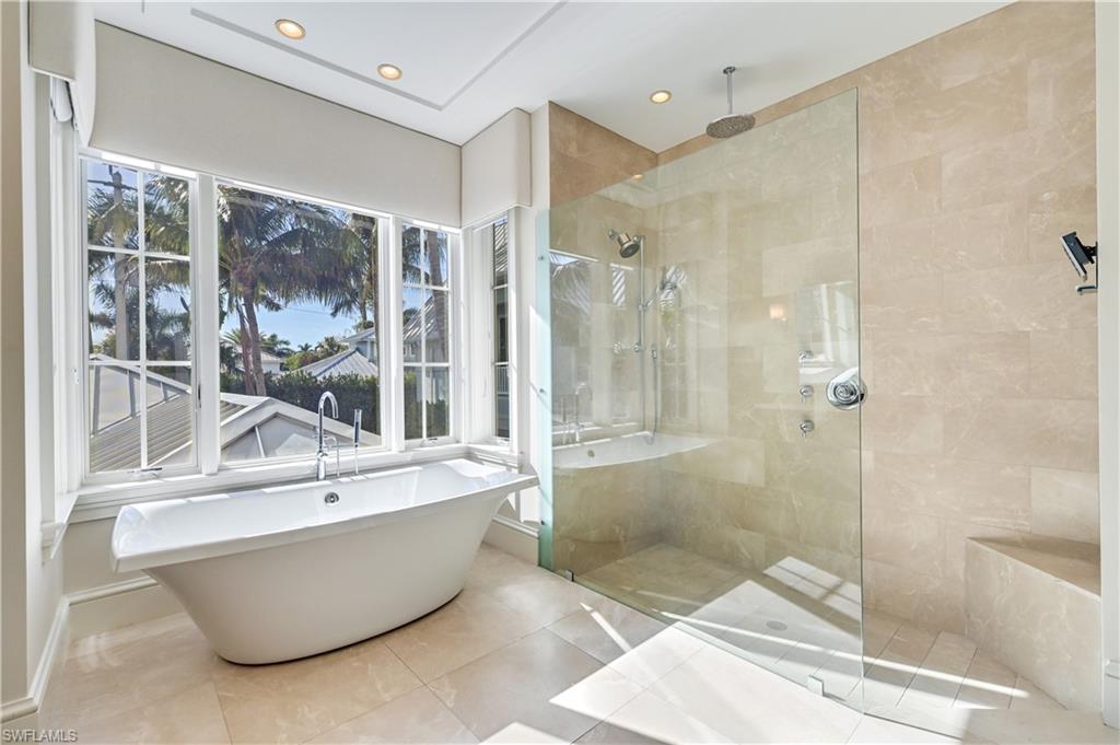 42 6th Street South Naples, FL 34102 - Photo 36 of 46 Full bath featuring a soaking tub, a walk in shower, tile patterned floors, and recessed lighting
