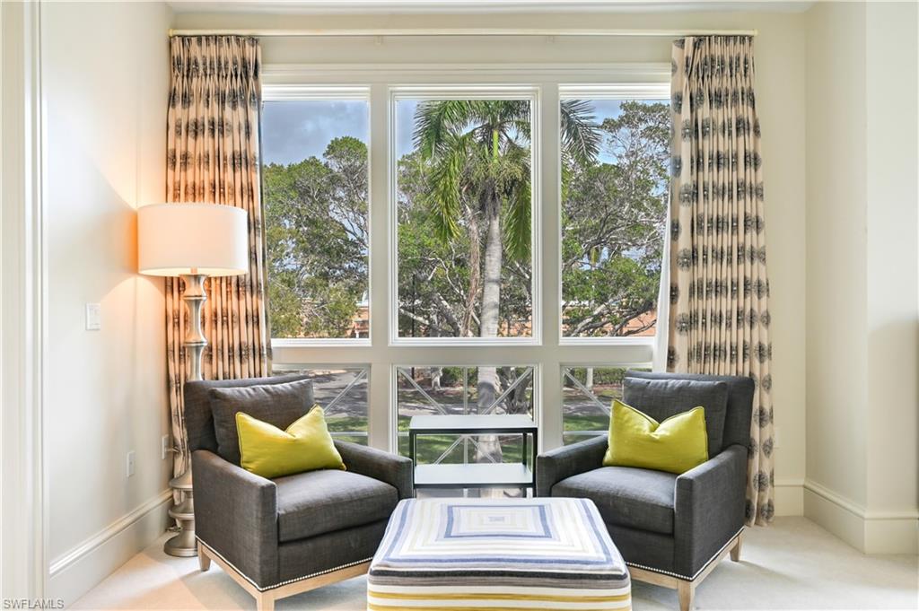 42 6th Street South Naples, FL 34102 - Photo 39 of 46 Living area featuring carpet and baseboards