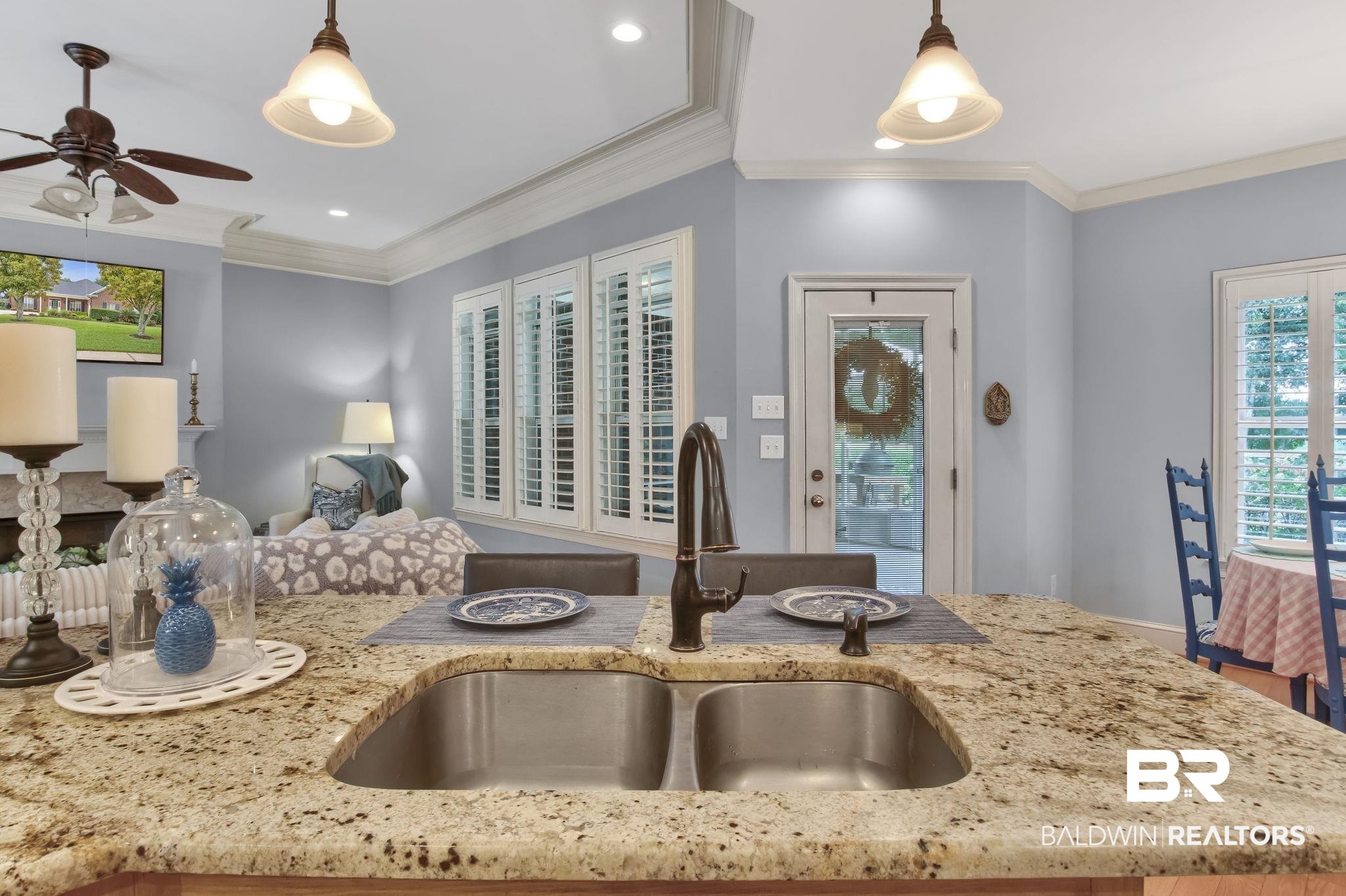 9478 Autauga Bend Daphne, AL 36526 - Photo 48 of 73 Kitchen featuring ornamental molding, hardwood / wood-style flooring, sink, and light stone countertops