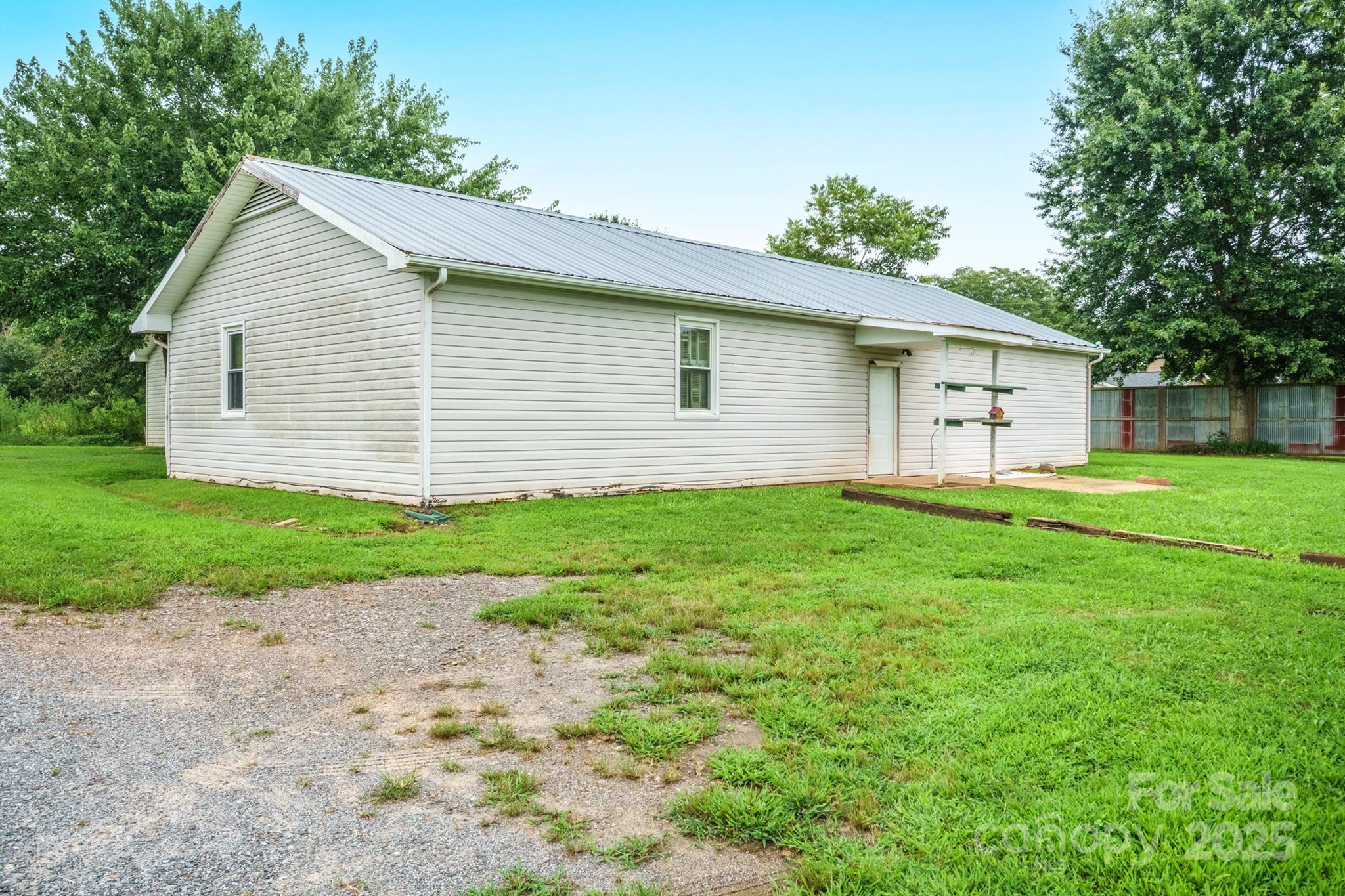a view of a house with a yard and garage