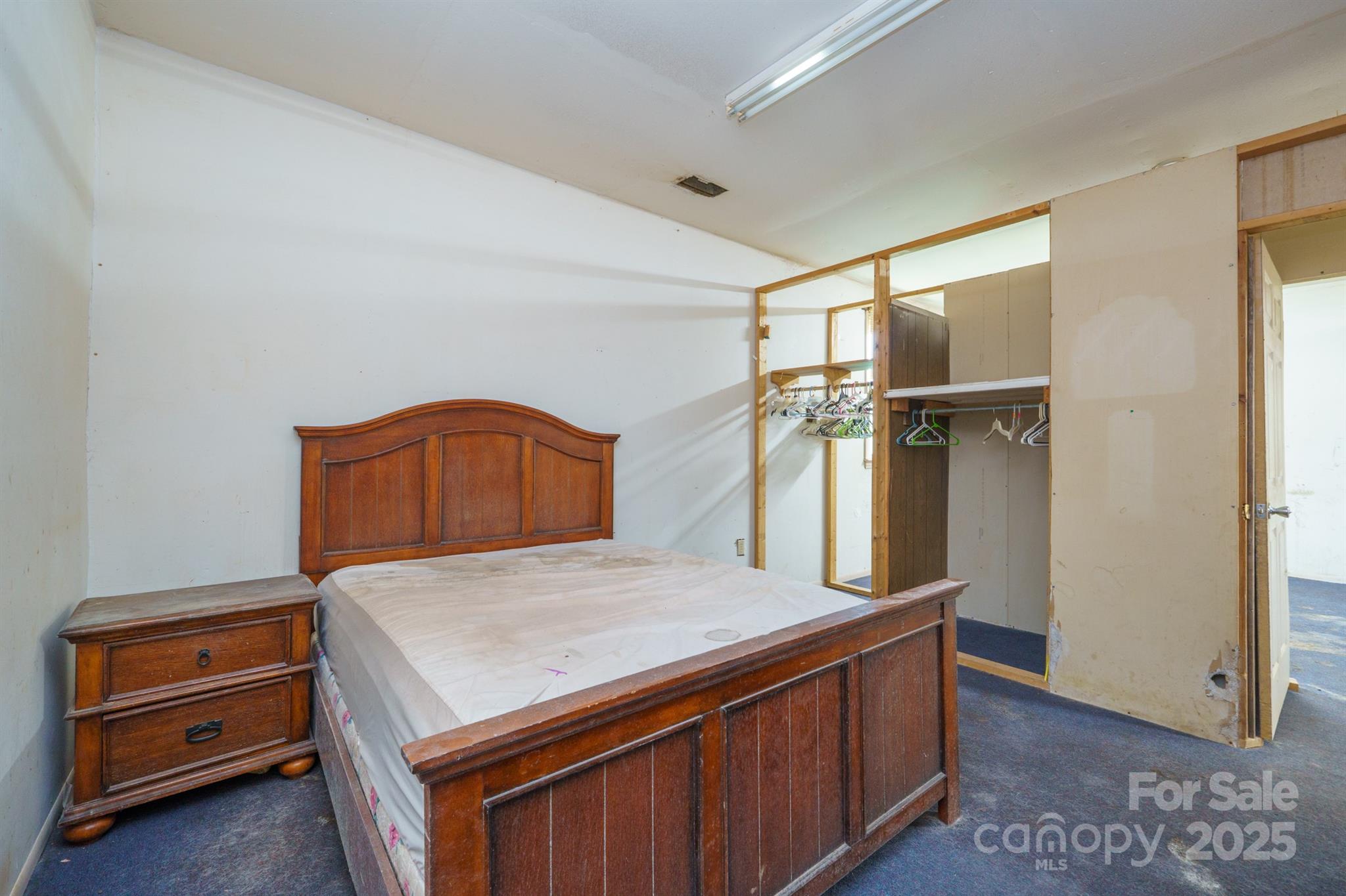 3450 Polkville Road Shelby, NC 28150 - Photo 12 of 29 a kitchen with stainless steel appliances cabinets and wooden floor