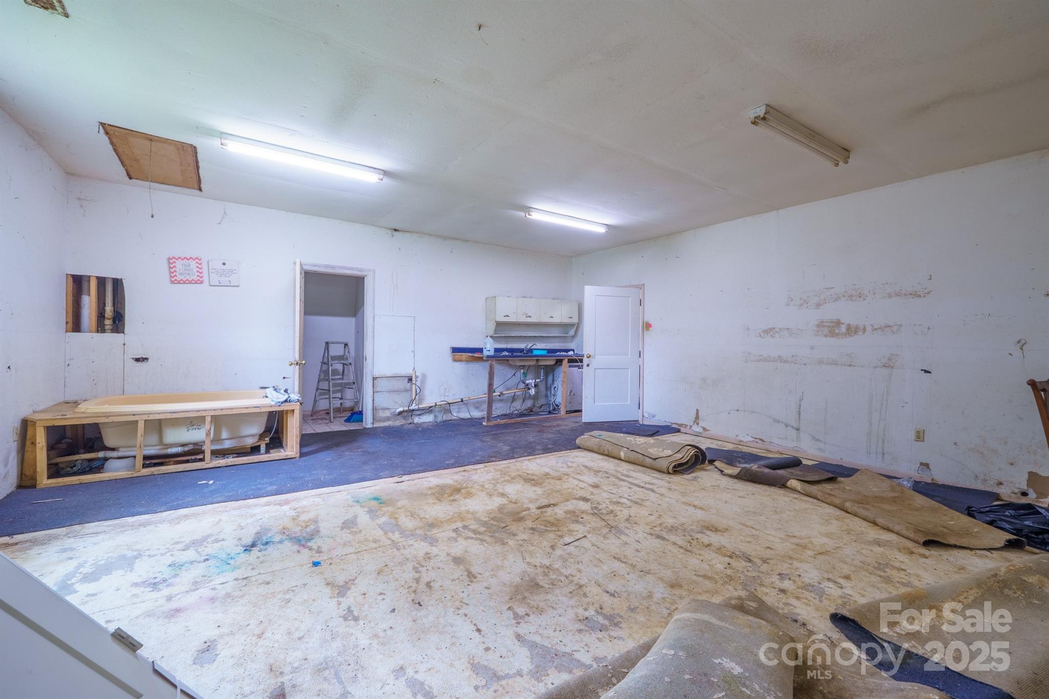 3450 Polkville Road Shelby, NC 28150 - Photo 18 of 29 a view of a livingroom with furniture and a flat screen tv