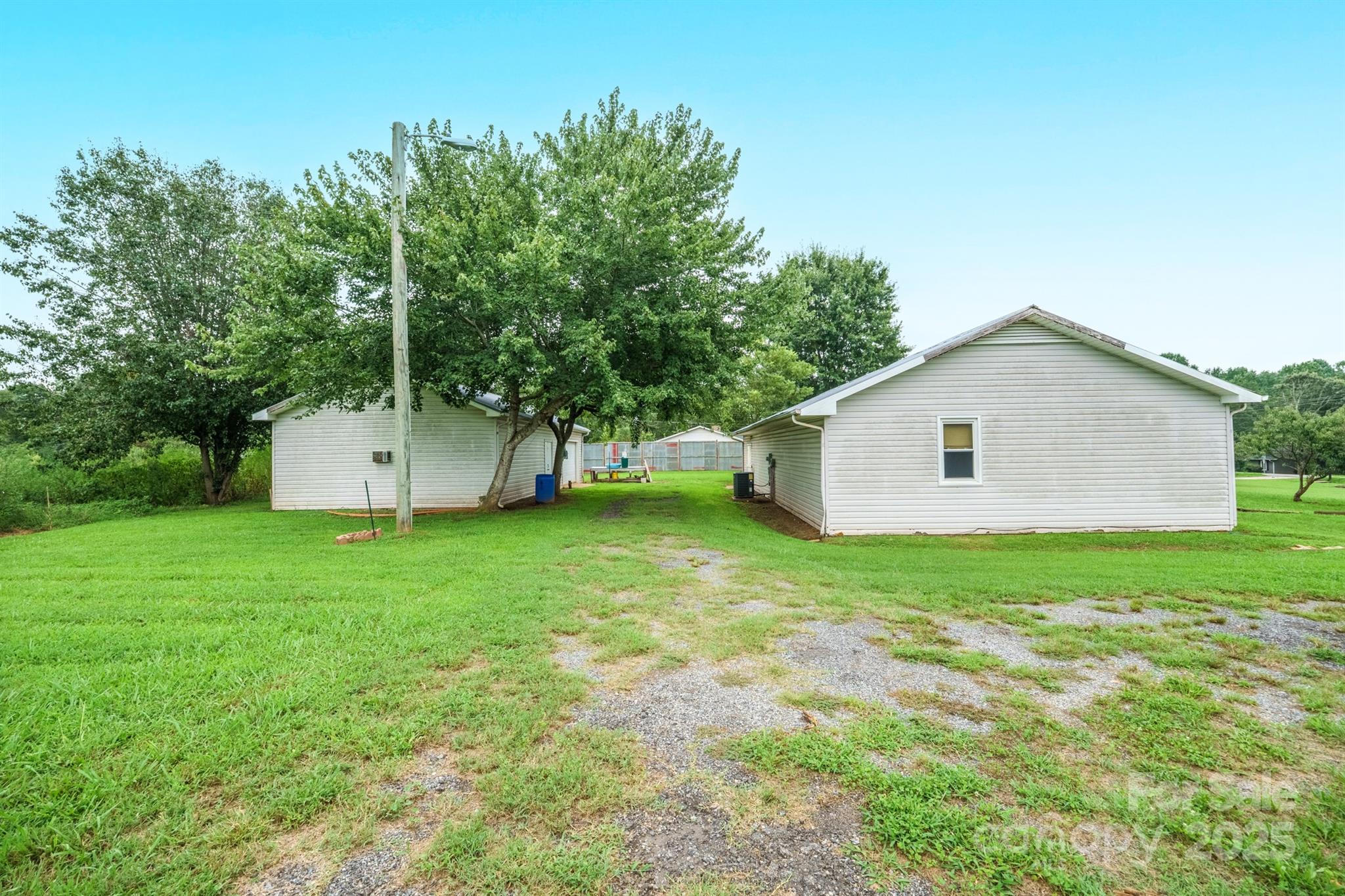 3450 Polkville Road Shelby, NC 28150 - Photo 26 of 29 a view of a backyard with large trees