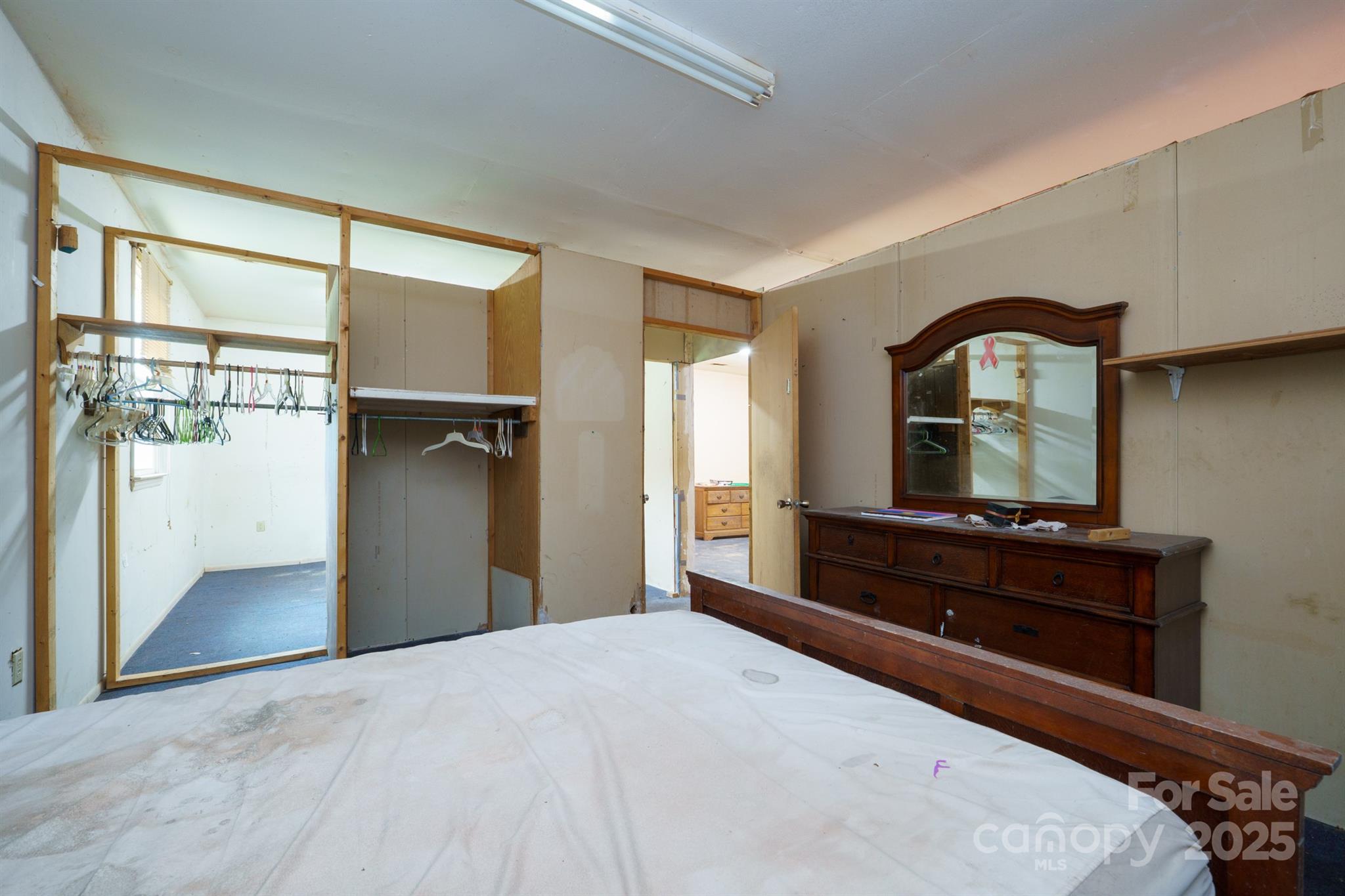 3450 Polkville Road Shelby, NC 28150 - Photo 10 of 29 a bedroom with a bed and a dresser