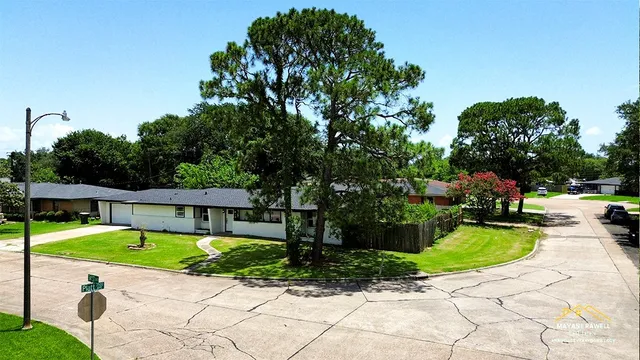 a view of a backyard with sitting area
