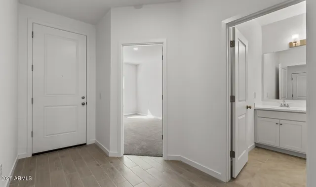 a living room with furniture kitchen and a table