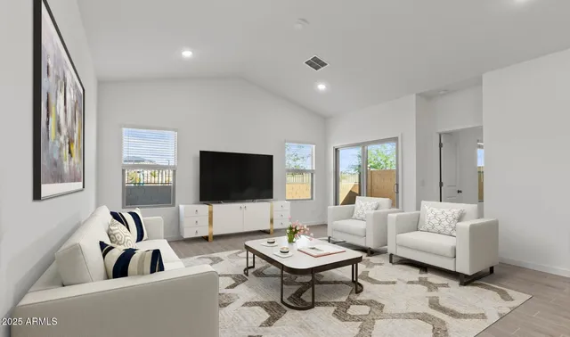 a living room with furniture and a table