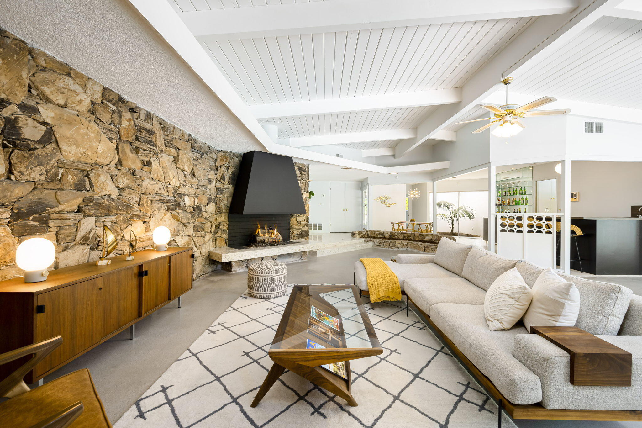 1333 East Deepwell Road Palm Springs, CA 92264 - Photo 1 of 44 a living room with furniture and a flat screen tv