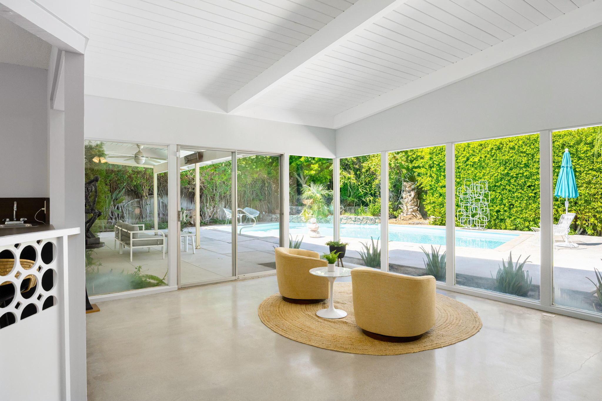 1333 East Deepwell Road Palm Springs, CA 92264 - Photo 11 of 44 a living room with furniture and a garden