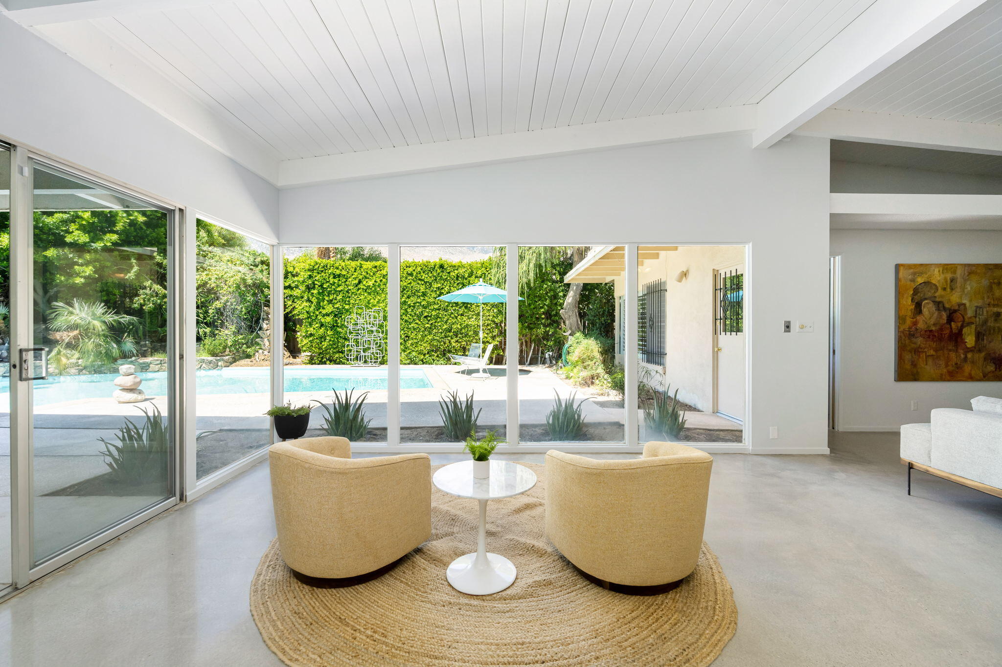 1333 East Deepwell Road Palm Springs, CA 92264 - Photo 12 of 44 a living room with furniture and a large window