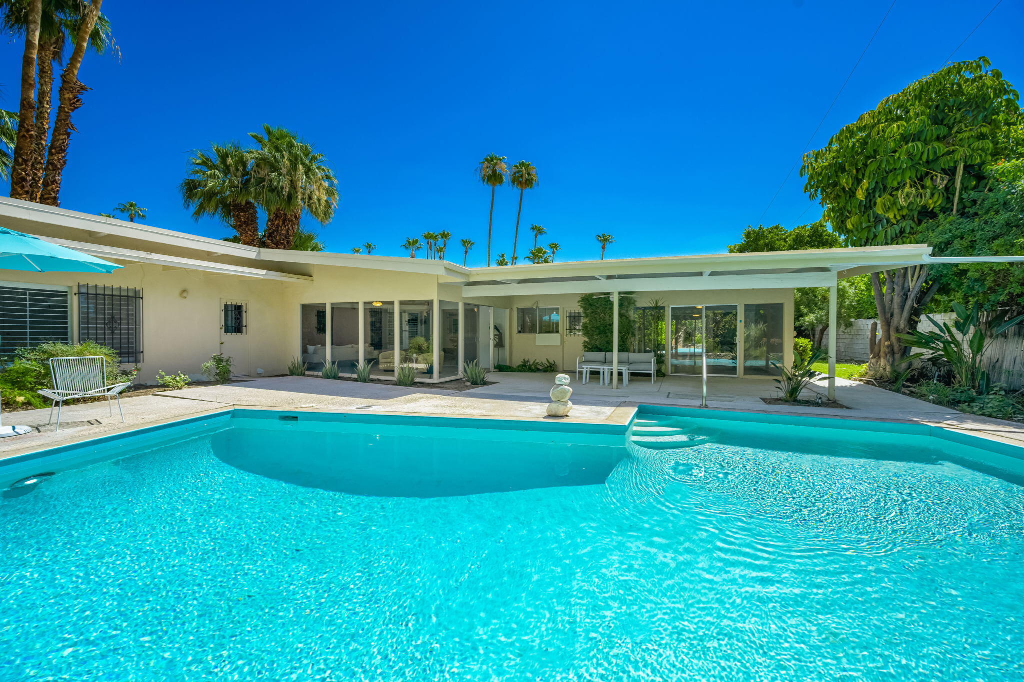 1333 East Deepwell Road Palm Springs, CA 92264 - Photo 18 of 44 a view of house with a swimming pool